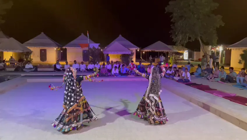 Kalbeliya dancers performing at the desert camp after dark