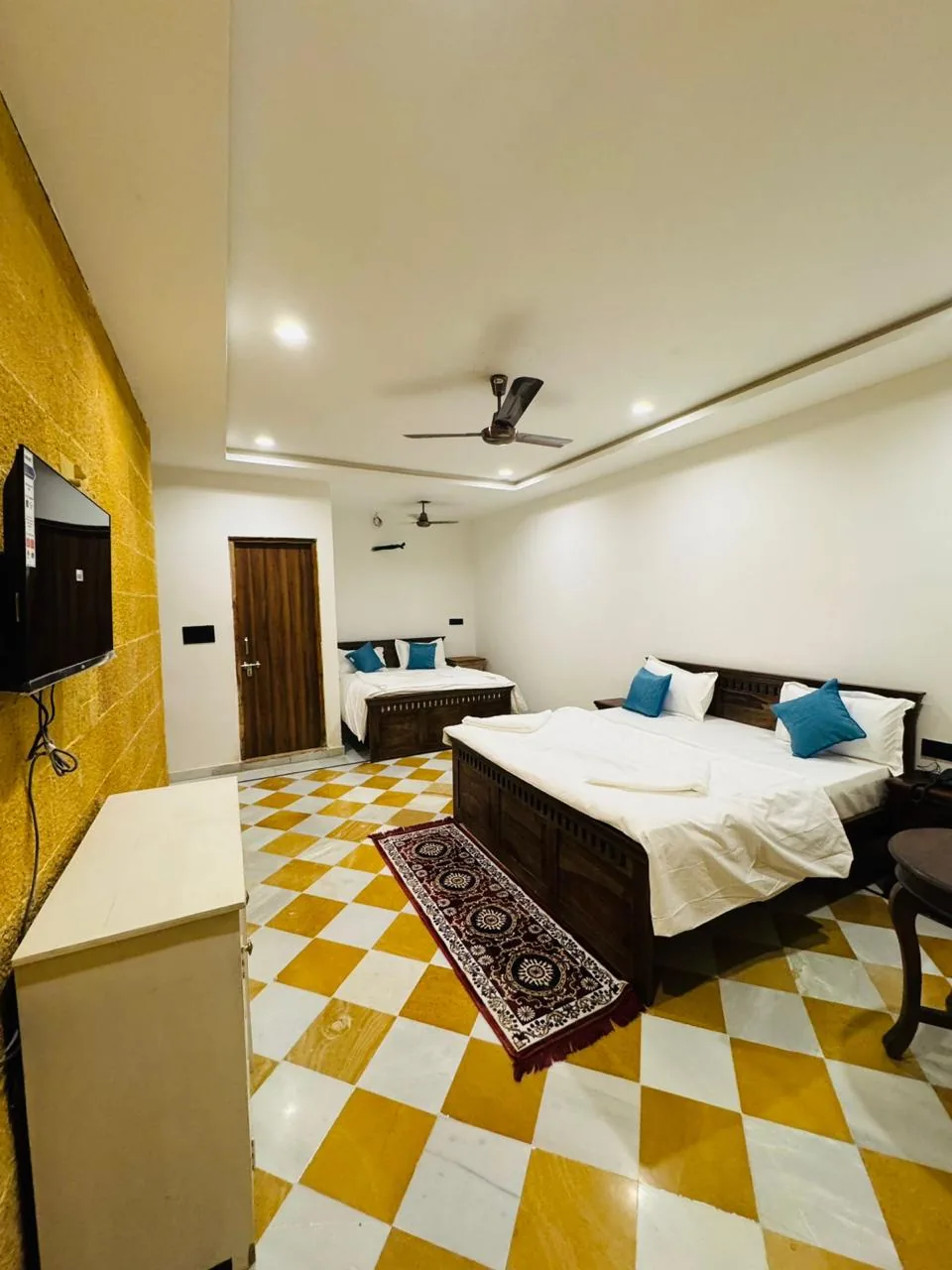 Gold and white marble chequerboard floor in a deluxe room